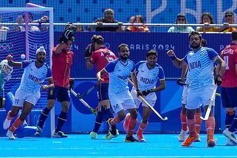Harmanpreet Singh celebrates after scoring his side's first goal against Spain